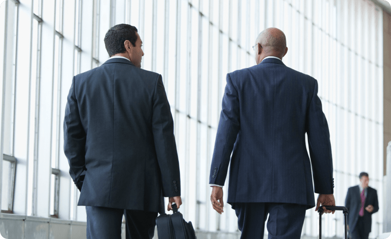 men walking with briefcases